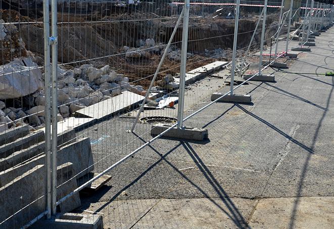 a temporary fence panel that provides privacy for a worksite